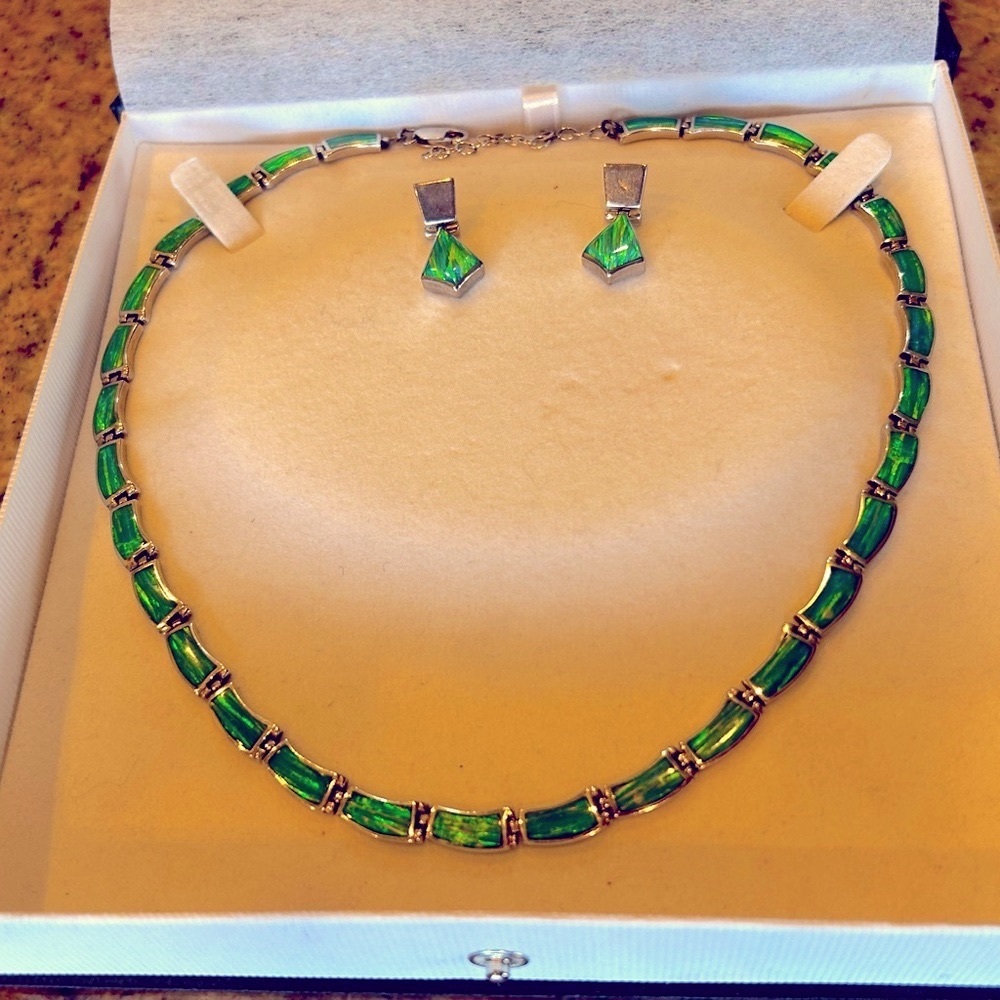 Green Fire Opal necklace and earrings in silver setting.